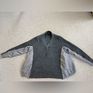 No size sweater. Fits me and I’m a small.